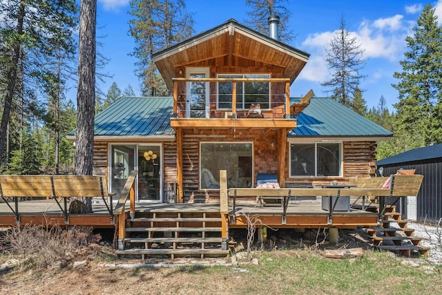 4167 Grouse Creek Rd, Loon Lake, WA 99148 - rear view of property with a standing seam roof, metal roof, a wooden deck, and log exterior