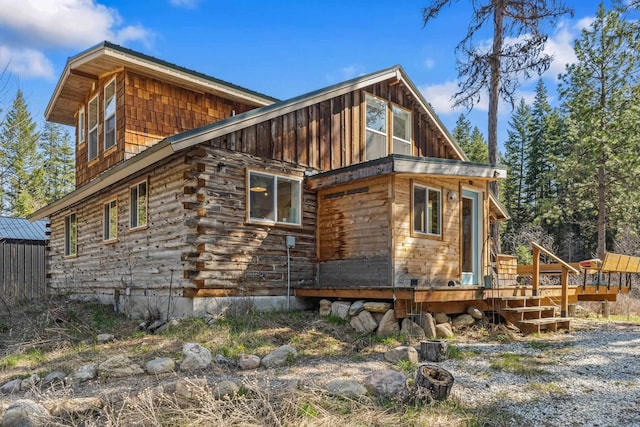 4167 Grouse Creek Rd, Loon Lake, WA 99148 - back of house featuring a deck and board and batten siding