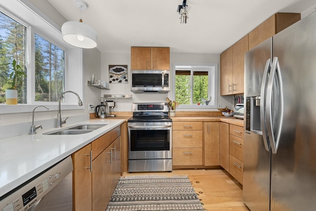 4167 Grouse Creek Rd, Loon Lake, WA 99148 - kitchen featuring light countertops, light wood-type flooring, a sink, and stainless steel appliances