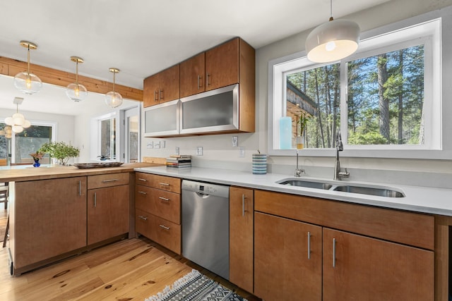 4167 Grouse Creek Rd, Loon Lake, WA 99148 - kitchen featuring light countertops, light wood-type flooring, stainless steel dishwasher, and a sink