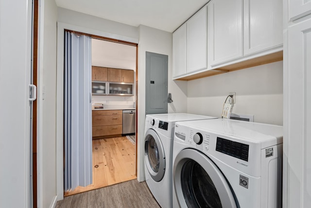 4167 Grouse Creek Rd, Loon Lake, WA 99148 - washroom with electric panel, light wood-style flooring, separate washer and dryer, and cabinet space