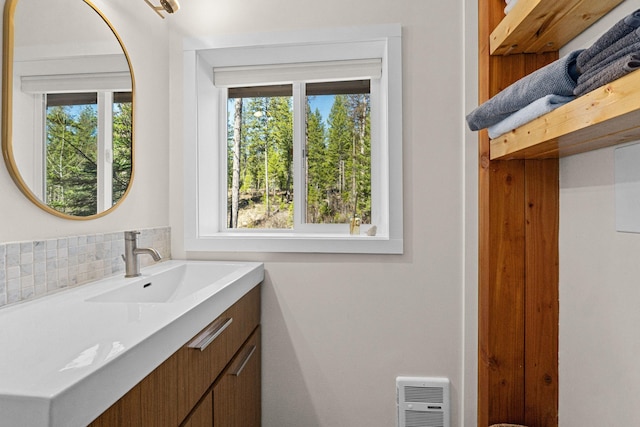 4167 Grouse Creek Rd, Loon Lake, WA 99148 - bathroom featuring vanity and decorative backsplash