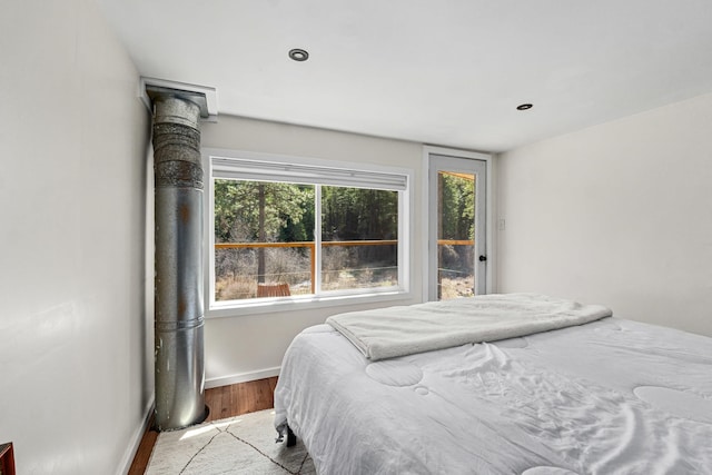 4167 Grouse Creek Rd, Loon Lake, WA 99148 - bedroom with baseboards and wood finished floors