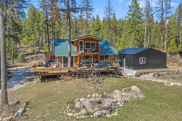 4167 Grouse Creek Rd, Loon Lake, WA 99148 - rear view of property with a wooded view, a yard, metal roof, a wooden deck, and log siding
