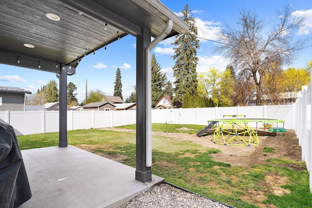 view of yard with a patio area and a fenced backyard