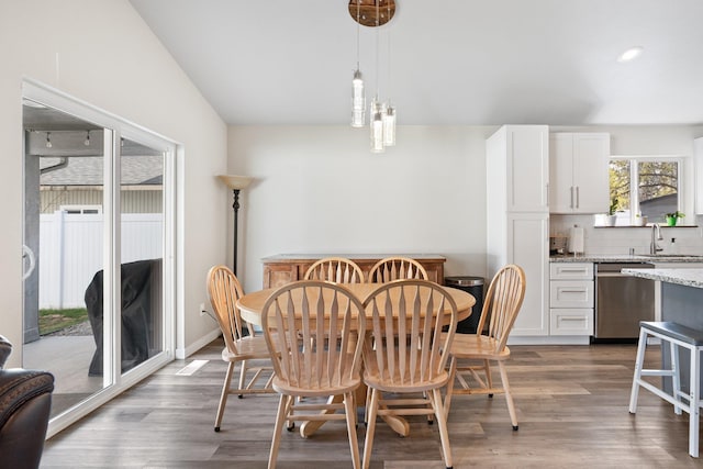 dining room with recessed lighting and wood finished floors