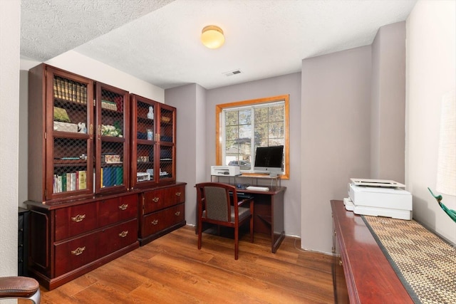 5905 W Excell Ave, Spokane, WA 99208 - home office with visible vents and wood finished floors