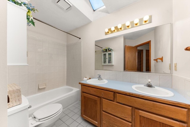 5905 W Excell Ave, Spokane, WA 99208 - full bath featuring a sink, tile patterned floors, toilet, and double vanity