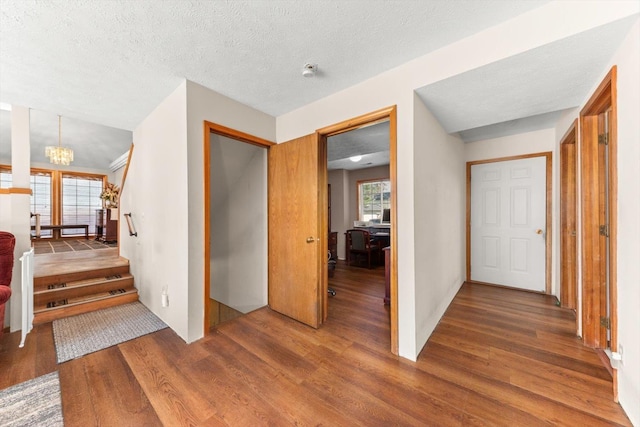 5905 W Excell Ave, Spokane, WA 99208 - corridor with a chandelier and wood finished floors