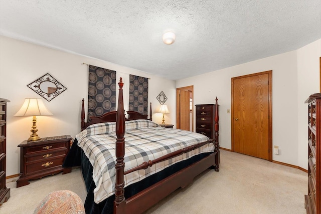 5905 W Excell Ave, Spokane, WA 99208 - bedroom featuring a textured ceiling, light colored carpet, and baseboards