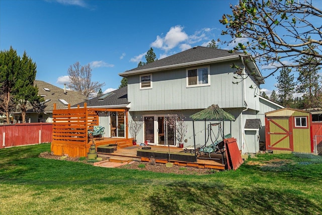 5905 W Excell Ave, Spokane, WA 99208 - rear view of property featuring an outbuilding, a storage unit, fence, and a wooden deck