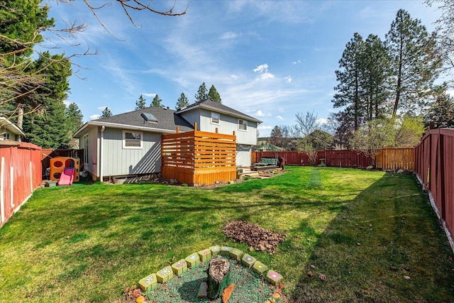 5905 W Excell Ave, Spokane, WA 99208 - view of yard featuring a deck and a fenced backyard
