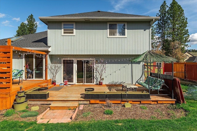 5905 W Excell Ave, Spokane, WA 99208 - back of property with fence, a deck, and a shingled roof