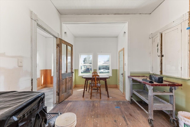hall with hardwood / wood-style floors