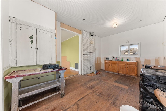 interior space featuring visible vents and dark wood finished floors