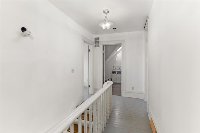 corridor featuring visible vents and light wood-type flooring