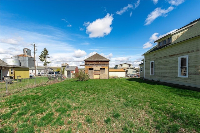 view of yard with a fireplace and fence