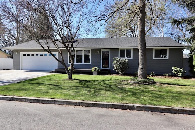 14314 E 22nd Ave, Spokane Valley, WA 99037 - ranch-style home featuring a garage, driveway, fence, and a front lawn