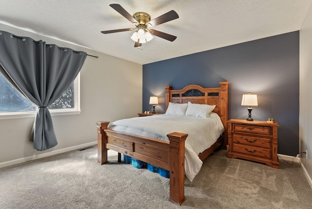 bedroom featuring visible vents, baseboards, a ceiling fan, and carpet