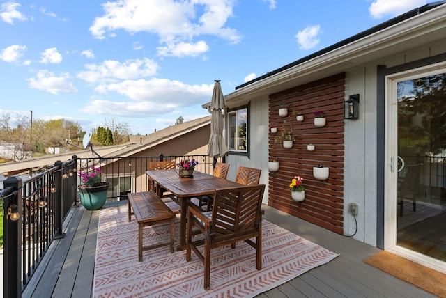 deck with outdoor dining space