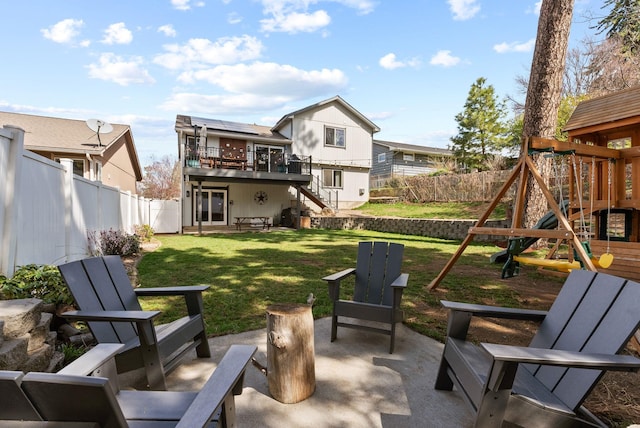 exterior space with a fenced backyard and a playground