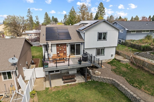 back of house with a wooden deck, a fenced backyard, a patio area, a gate, and a shingled roof