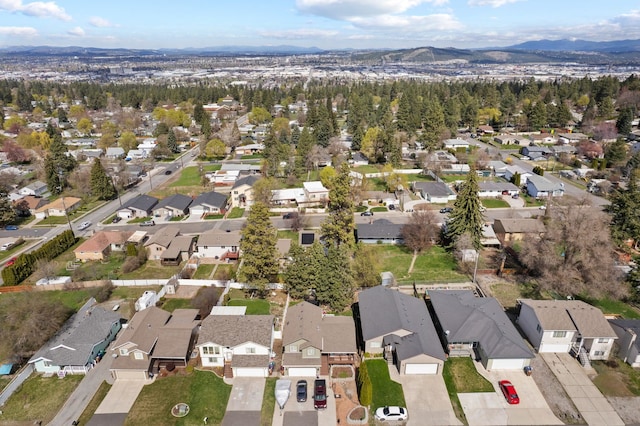drone / aerial view featuring a mountain view and a residential view