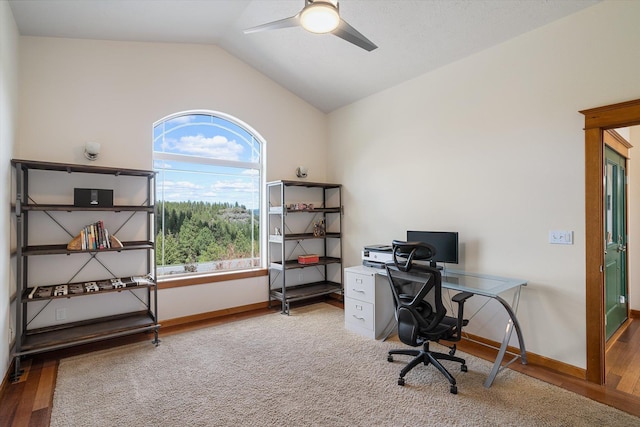 home office with wood finished floors, baseboards, a ceiling fan, and lofted ceiling