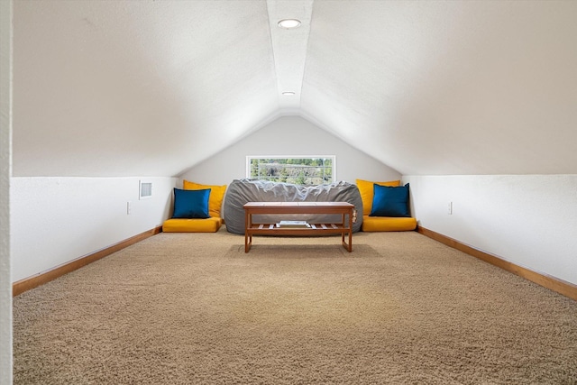 bedroom featuring carpet flooring, baseboards, and lofted ceiling