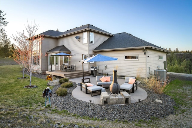 back of property featuring outdoor dining space, roof with shingles, central air condition unit, an outdoor hangout area, and a yard