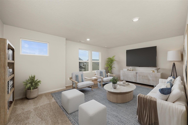carpeted living room featuring visible vents, baseboards, and recessed lighting