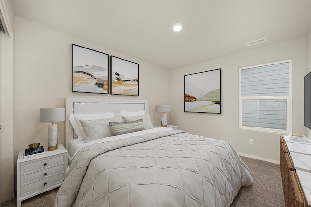 carpeted bedroom featuring recessed lighting, visible vents, and baseboards
