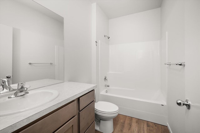 full bathroom featuring toilet, shower / tub combination, vanity, and wood finished floors