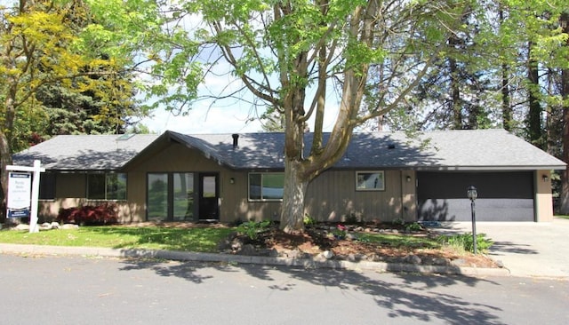 10224 N Briar Cliff Dr, Spokane, WA 99218 - single story home with concrete driveway and a garage