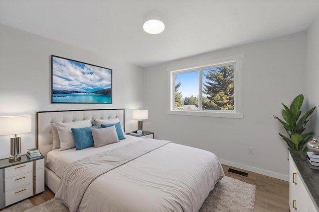 16409 N Birdie Rd, Nine Mile Falls, WA 99026 - bedroom with light wood finished floors and baseboards
