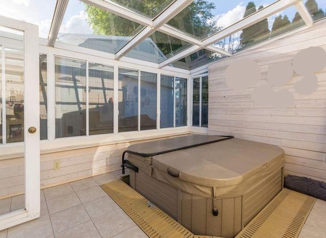 sunroom featuring a jacuzzi