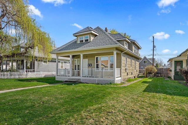 723 W Montgomery Ave, Spokane, WA 99205 - view of front of house featuring a chimney, a shingled roof, and covered porch