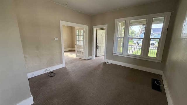 723 W Montgomery Ave, Spokane, WA 99205 - unfurnished room with baseboards and carpet floors