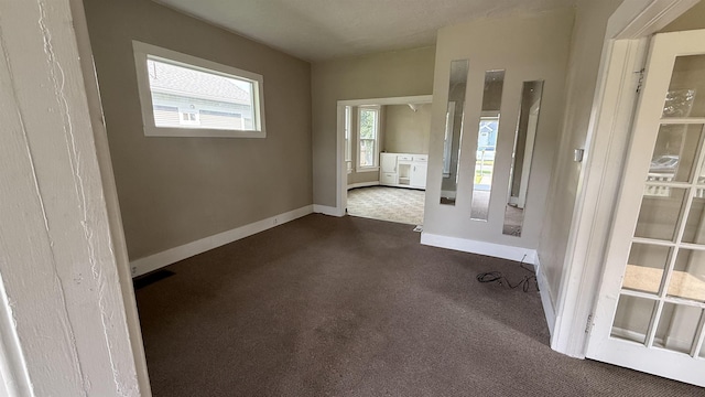 723 W Montgomery Ave, Spokane, WA 99205 - empty room featuring dark carpet