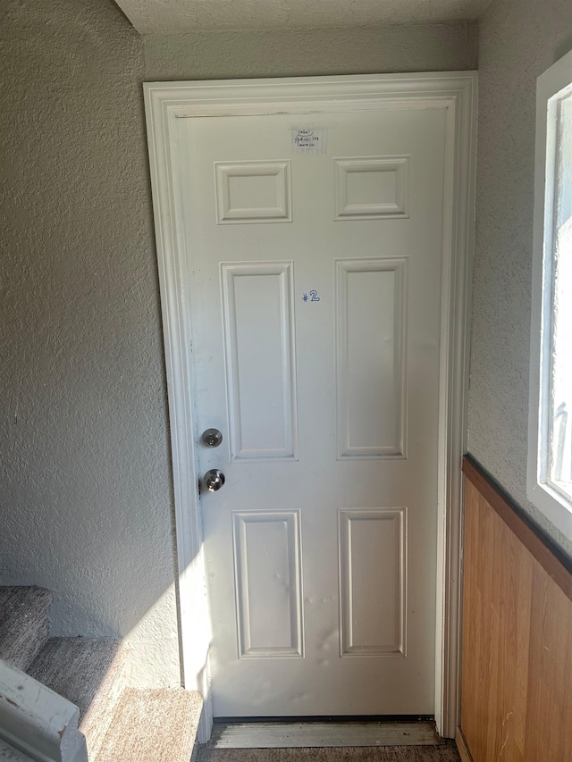 entrance to property with stucco siding