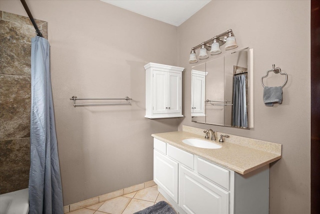 bathroom featuring baseboards, a shower with curtain, a tub to relax in, vanity, and tile patterned flooring