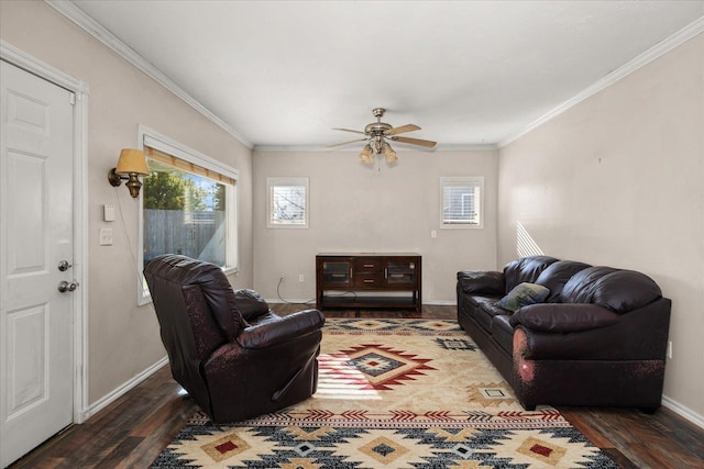 living room with crown molding, wood finished floors, ceiling fan, and baseboards