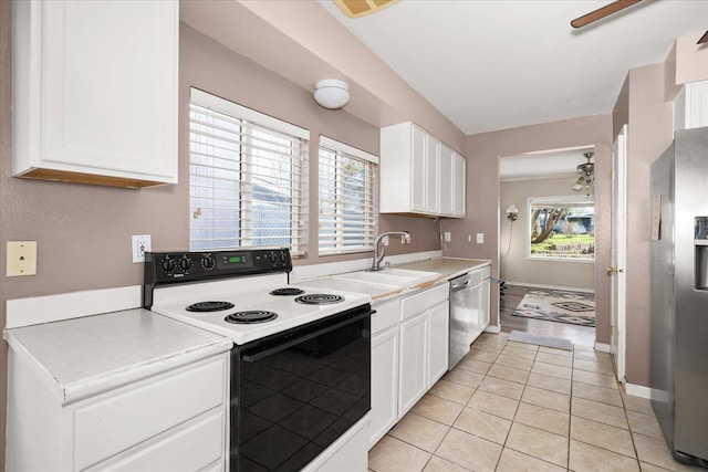 kitchen with ceiling fan, white cabinets, light countertops, a sink, and stainless steel appliances