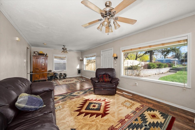 living room featuring baseboards, wood finished floors, and ceiling fan