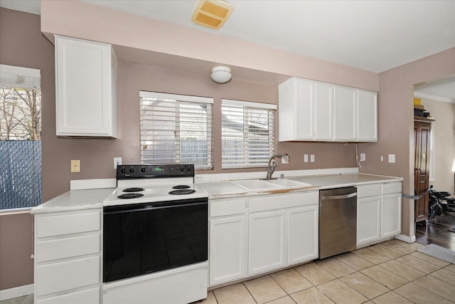 kitchen with plenty of natural light, light countertops, range with electric stovetop, dishwasher, and a sink