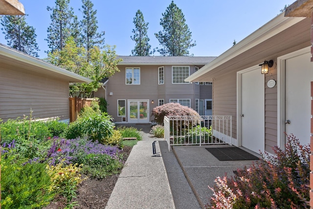 view of exterior entry with a patio