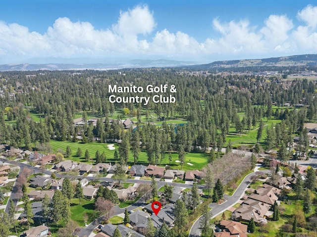 birds eye view of property with a forest view