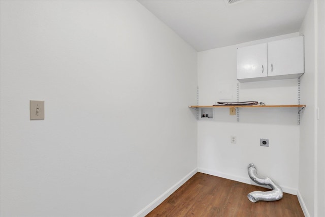 laundry room with baseboards, washer hookup, dark wood-style floors, hookup for an electric dryer, and cabinet space