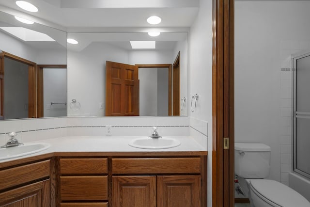 full bathroom featuring a sink, a skylight, and double vanity