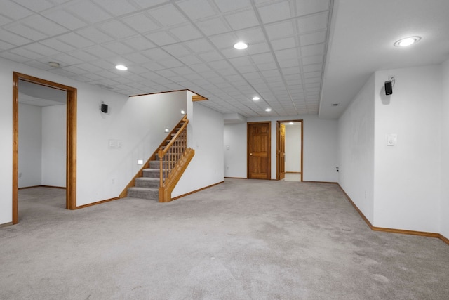 finished below grade area with baseboards and carpet floors
